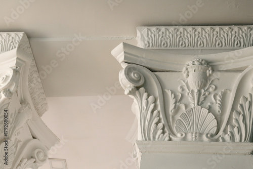 Photos Beautiful architectural moldings on the columns under the ceiling