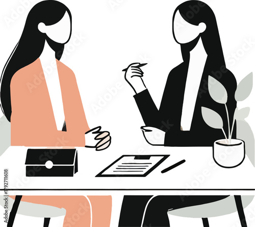 Two women in business attire meeting at a desk with documents