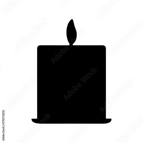 Elegant silhouette of a burning candle with a warm and serene ambiance