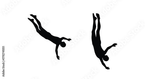 Silhouettes of two people diving or falling in dynamic poses
