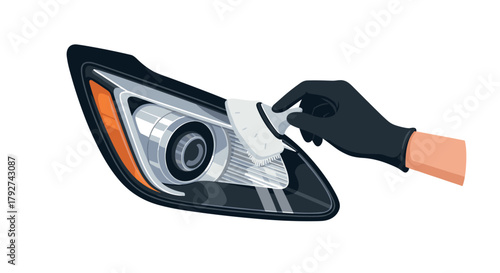 Cleaning car headlight with gloved hand for optimal clarity and shine