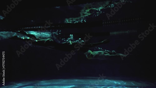 Cinematic Underwater Start with Dolphin Kick by Professional Swimmers, 4K Slow Motion