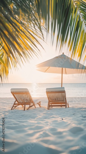 Relaxing Beach Scene With Chairs and Umbrella at Sunset by the Ocean.
