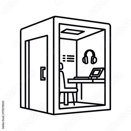 Sound recording booth with person, desk, laptop, and headphones