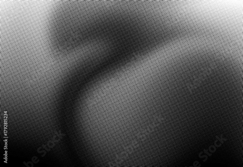 Close up grayscale halftone texture with dotted pattern creating abstract art ideal for backgrounds, design layouts, typography, and editorial imagery in creative projects