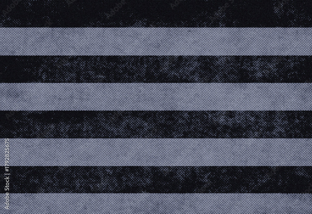 Fototapeta premium Close up of an abstract urban texture featuring stripes in dark and light gray on a gritty asphalt surface, creating a striking geometric composition and industrial vibe.