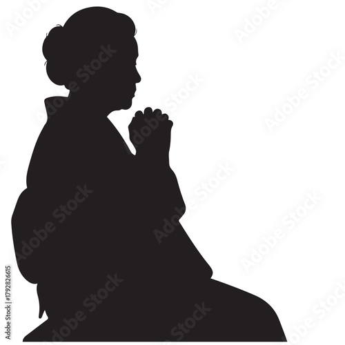 Profile Silhouette of an Older Woman in Prayer