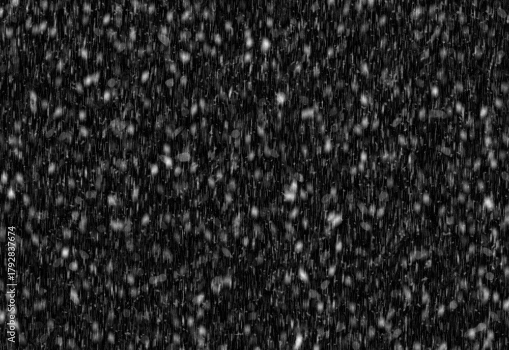 Fototapeta premium Close up of fine white specks scattered across a deep black background, creating a granular texture suitable for winter scenes, star field effects, and abstract design projects
