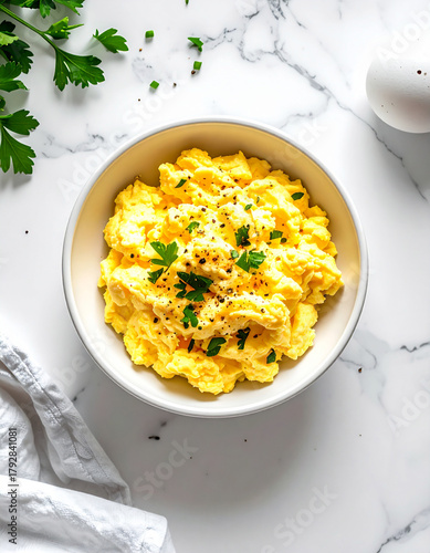 scrambled eggs in a bowl, viewed from above