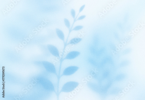Soft blue watercolor background featuring a delicate vertical sprig of leaves, creating a serene botanical motif perfect for nature inspired design and tranquil visuals
