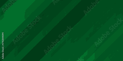 Abstract diagonal brush stroke pattern in varying shades of deep green for a textured background design