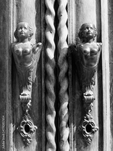 Historic buildings along a street of Belluno, Italy