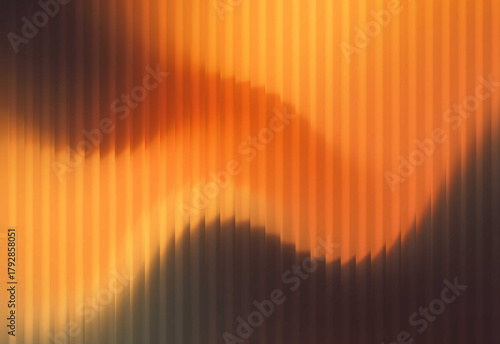 Abstract close up of warm orange and dark tones with vertical corrugated textures creating flowing curves and soft gradient lighting for an artistic background design concept