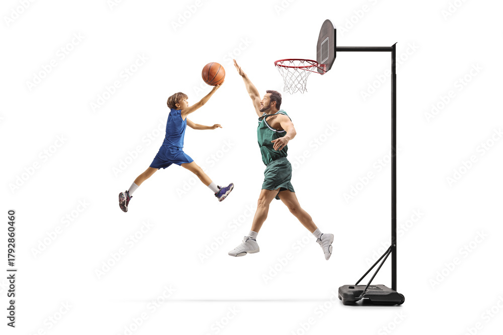 Naklejka premium Man playing basketball with a boy