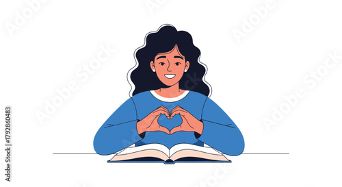 A young woman makes a heart shape with her hands over an open book.