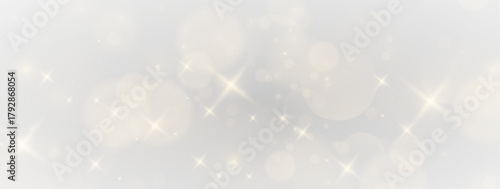 Twinkling festive atmosphere with sparkling dust clouds, magical flare ribbons and illuminated golden textures in a dreamy cosmic background