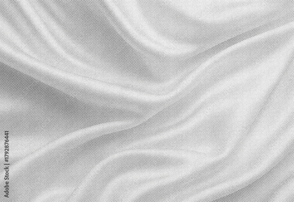 Fototapeta premium Close up of soft gray fabric with flowing folds and smooth woven texture, creating a versatile background for design, textile presentations, product photography, and layouts