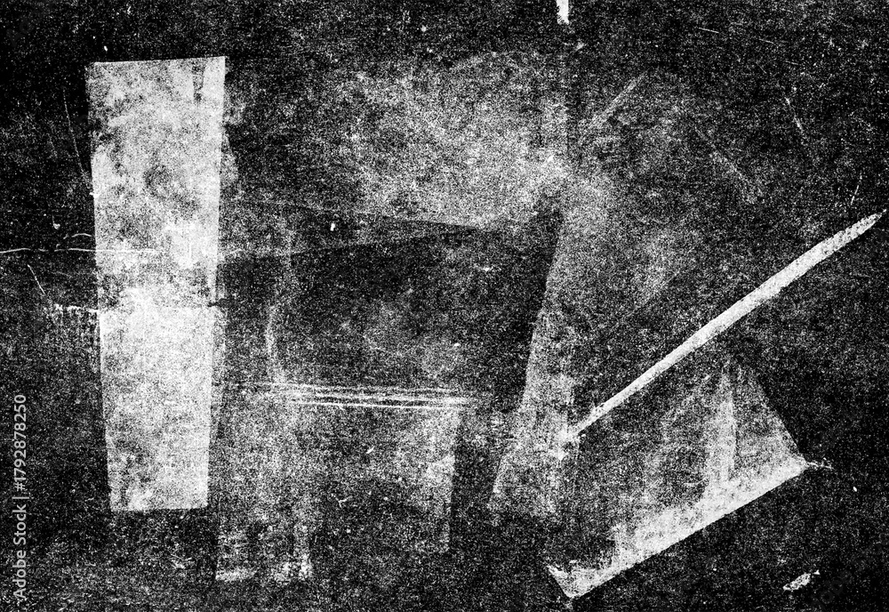 Fototapeta premium Grunge abstract black and white texture featuring weathered surface, distressed paper fragment and geometric shard patterns forming a moody cinematic background for design projects