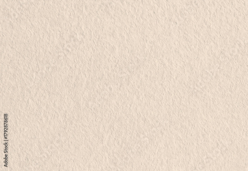 Close up of a warm beige textured paper background showing subtle fibers, soft natural color variations, and a gentle patterned surface suitable for invitations and backgrounds