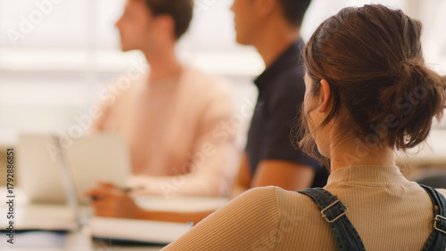 Close Up Of Young Multi Cultural Business Team Meeting Around Table In Modern Office