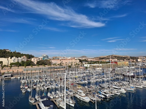 spain marcia jan 4 2024 Marina Full of Sailboats in a Coastal City Harbor Under Bright Blue Sky