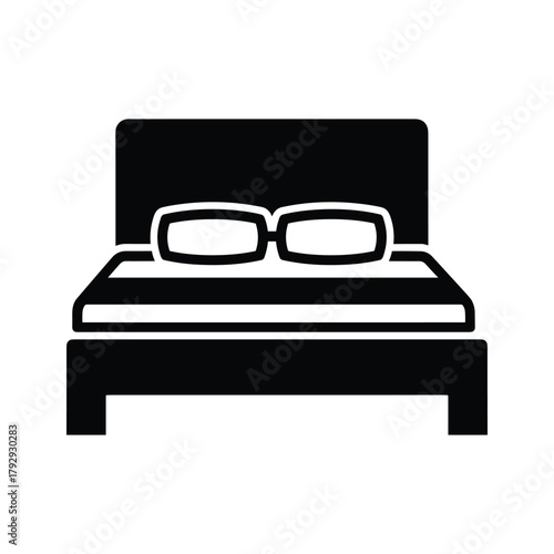Black icon of a bed with two pillows and a headboard
