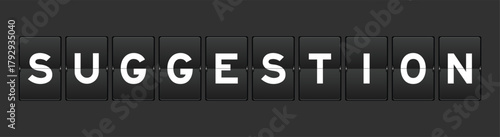 Black color analog flip board with word suggestion on gray background