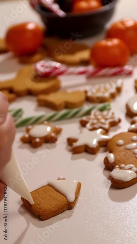 This joyful cooking activity features the process of creating homemade gingerbread cookies. Watch as colorful icing decorates traditional shapes, perfect for Christmas gatherings.
