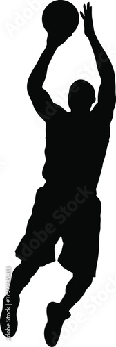 Silhouette of a basketball player in mid air shooting a basketball