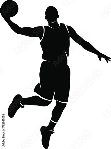 Silhouette of a basketball player dunking a ball
