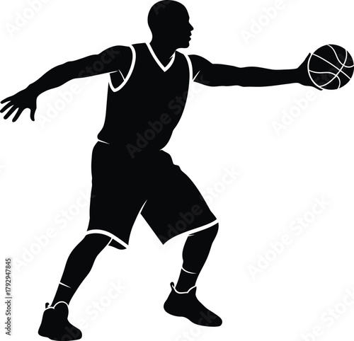 Silhouette of a basketball player dribbling the ball