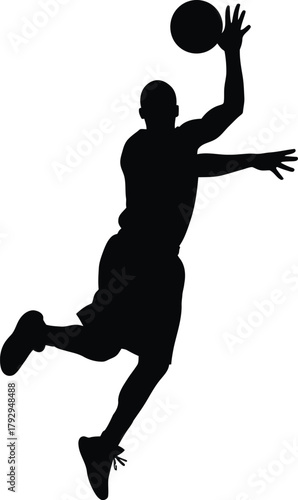Silhouette of a basketball player jumping to dunk a basketball