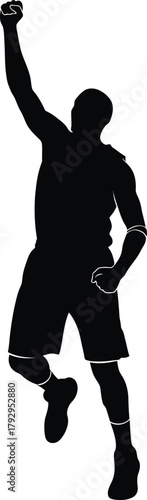 Silhouette of a basketball player jumping with arm raised