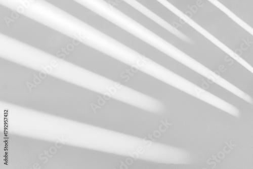 Gray shadow and light blur abstract background on white wall  from window. Dark stripe grey shadows indoor in room  background, monochrome, shadow overlay effect for backdrop and mockup design