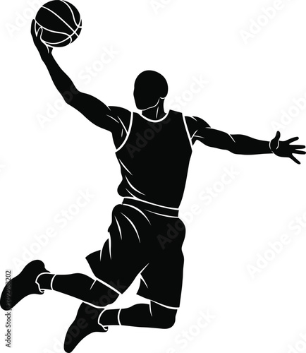 Silhouette of a basketball player dunking the ball in mid air