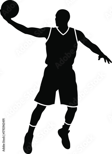 Silhouette of a basketball player mid air preparing to shoot
