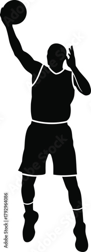 Silhouette of a basketball player shooting a ball