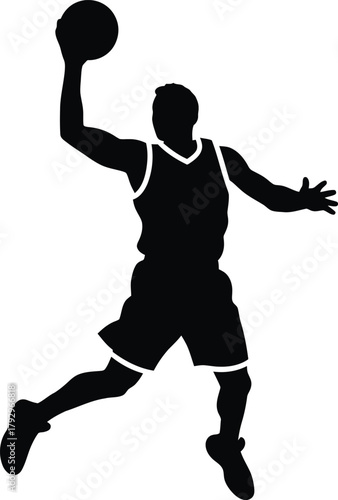 Silhouette of a basketball player dunking a ball