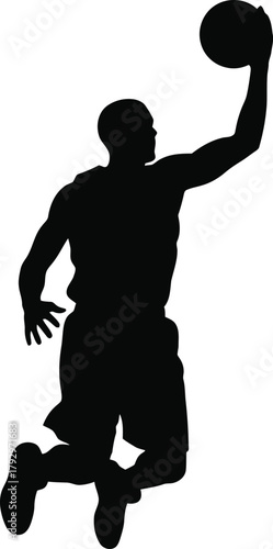 Silhouette of a basketball player in mid air making a dunk