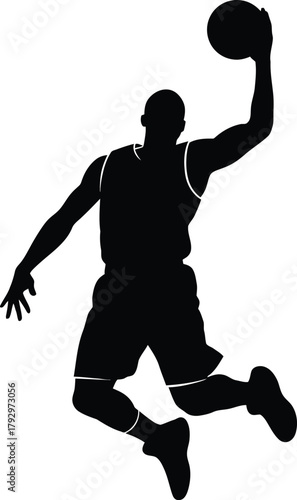 Silhouette of a basketball player performing a slam dunk
