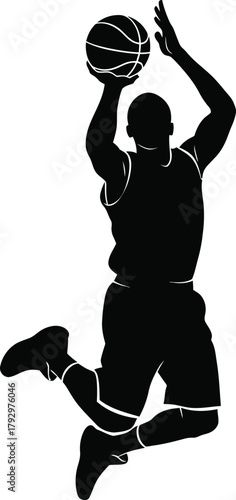 Silhouette of a basketball player in mid air shooting a ball