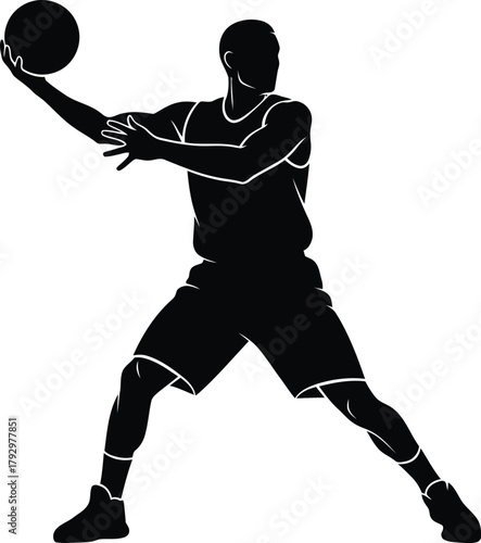 Silhouette of a basketball player in action holding a ball
