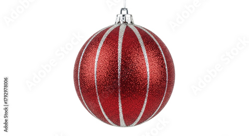 Photos Isolated red Christmas ornament with glittering bands, a shiny hanging holiday d