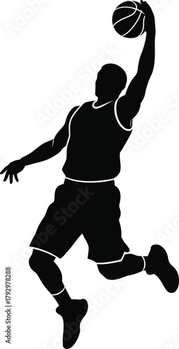 Silhouette of a basketball player performing a slam dunk