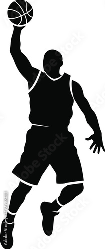 Silhouette of a basketball player dunking a ball