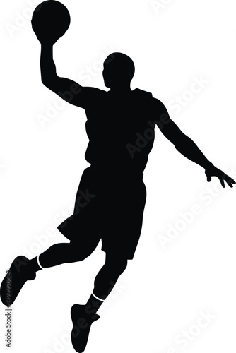 Silhouette of a basketball player mid air during a dunk