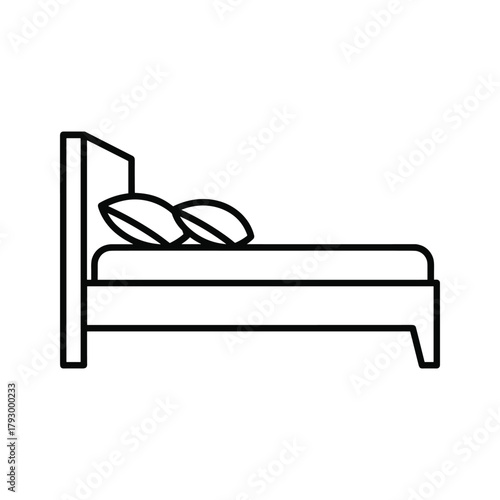 Bed with headboard and pillows