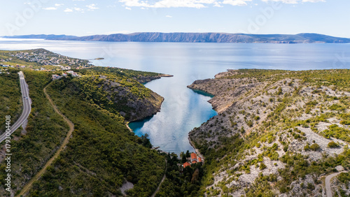 Cinematic Aerial View of Croatian Landscape – Blue Adriatic Bay Surrounded by Wild Forests and Untouched Mediterranean Nature