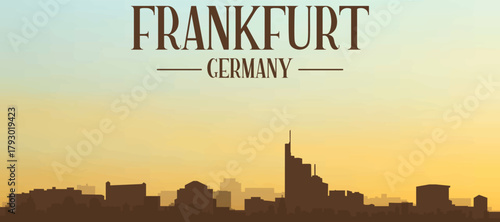 Panoramic poster of the city skyline with misty background buildings, hills sunrise, sunset and clouds of FRANKFURT, GERMANY
