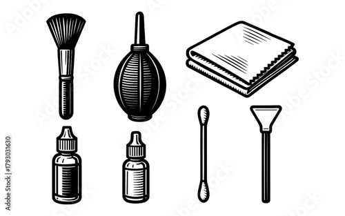 Vintage camera cleaning tools collection with brushes, blower, bottles, and cloth in black and white design
